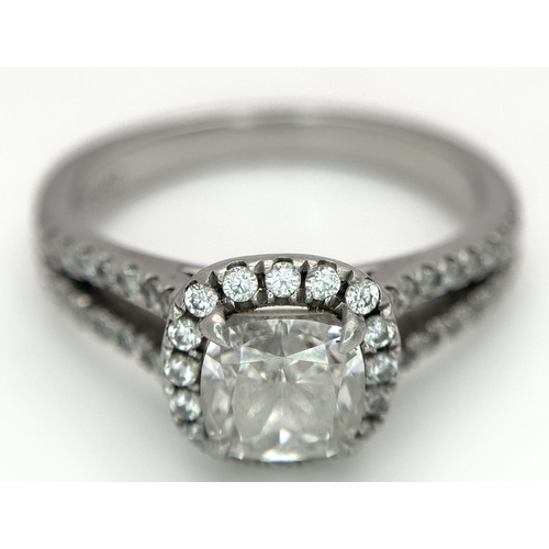 15 - A Platinum 950 and Diamond Dress Ring. A circa 1ct cushion cut diamond centre stone having J colour ... 