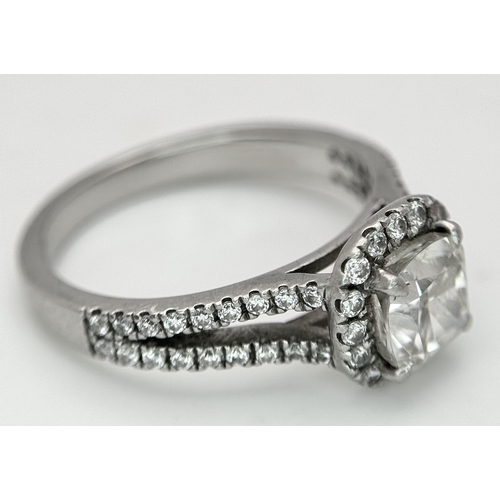 15 - A Platinum 950 and Diamond Dress Ring. A circa 1ct cushion cut diamond centre stone having J colour ... 