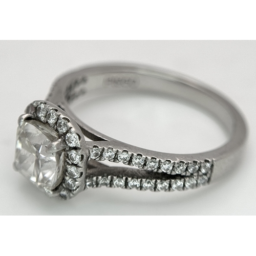 15 - A Platinum 950 and Diamond Dress Ring. A circa 1ct cushion cut diamond centre stone having J colour ... 
