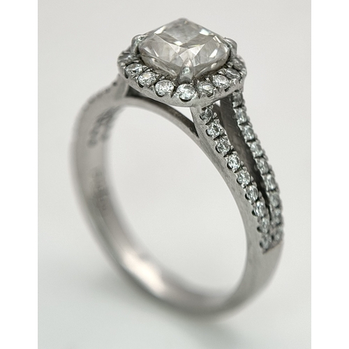 15 - A Platinum 950 and Diamond Dress Ring. A circa 1ct cushion cut diamond centre stone having J colour ... 