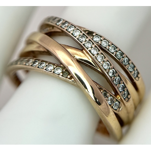 22 - A Pandora 14K Rose Gold (tests as) and Diamond Orbital Swirl Ring. 11mm at widest point. Circa 0.40c... 