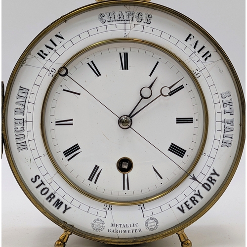 45 - An Antique Clock and Barometer in a Brass Drum Case. Most likely French, dating circa 1850. The oute... 
