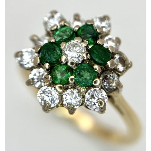 118 - An 18K Yellow Gold, Diamond and Emerald Cluster Ring. 0.50ctw. 3.8g, Size K. SC 2061