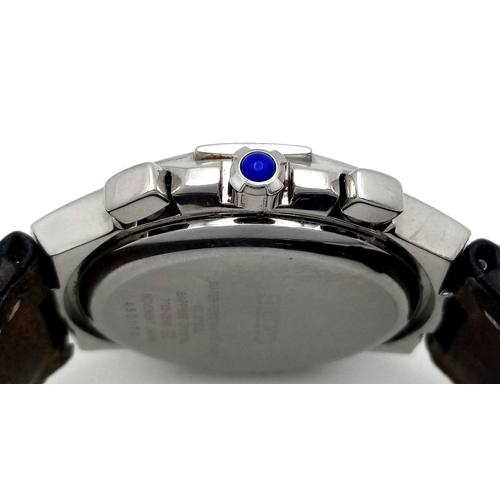 31 - A Rare Seiko Mother Of Pearl and Diamond Chronograph Quartz Ladies Watch. Model 7T62-OEMO. Black lea... 
