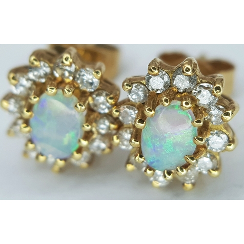 48 - A Pair of 18K Yellow Gold (tested), Diamond and Opal Set, Stud Earrings. 2.7g. TAN 2013