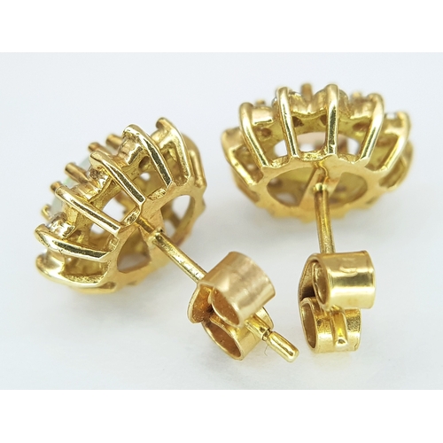 48 - A Pair of 18K Yellow Gold (tested), Diamond and Opal Set, Stud Earrings. 2.7g. TAN 2013