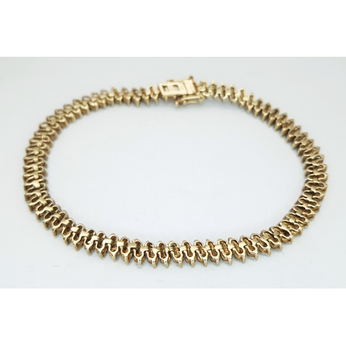 104 - A 9K Yellow Gold, Diamond Set Bracelet. 1.00ctw. 10.8g. SC 2024