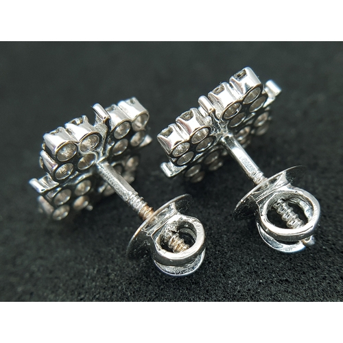 20 - A Pair of 14K White Gold, Diamond Set, Stud Earrings. 1.00ctw. 4.4g. TAN 2004