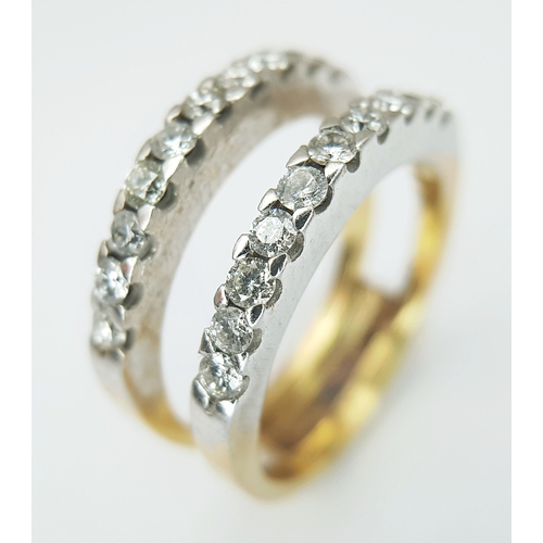 52 - An 18K Bi-Colour Gold (tested) Diamond and Sapphire Triple Band Ring. 0.40ctw diamond, 0.52ctw sapph... 