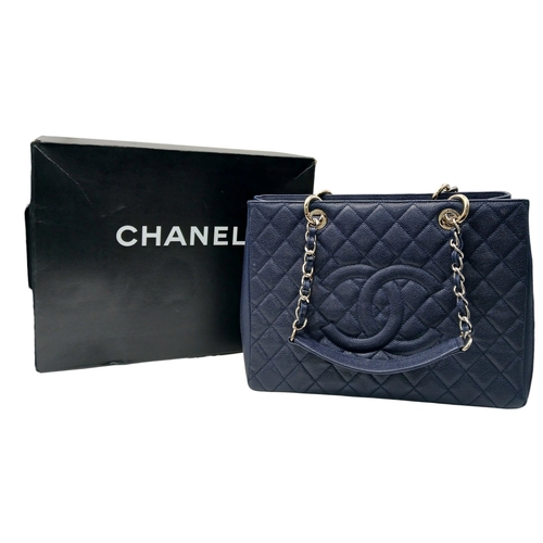 5 - A Navy Blue Chanel Grand Shopping Tote (GST) Bag. Navy Blue quilted caviar leather exterior with sil... 