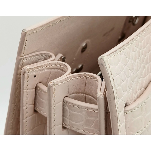 54 - A Baby Pink Saint Laurent Sac de Jour Handbag. Baby pink crocodile-embossed leather exterior with si... 