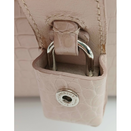 54 - A Baby Pink Saint Laurent Sac de Jour Handbag. Baby pink crocodile-embossed leather exterior with si... 