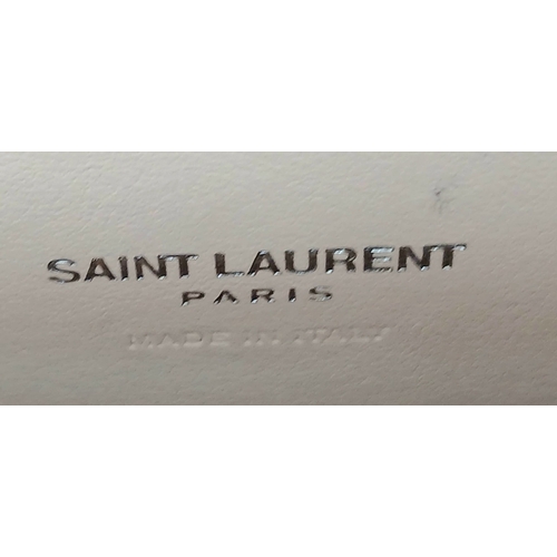 54 - A Baby Pink Saint Laurent Sac de Jour Handbag. Baby pink crocodile-embossed leather exterior with si... 