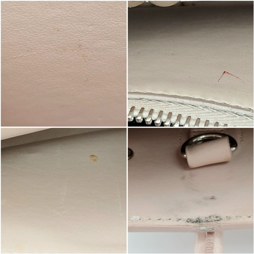 54 - A Baby Pink Saint Laurent Sac de Jour Handbag. Baby pink crocodile-embossed leather exterior with si... 
