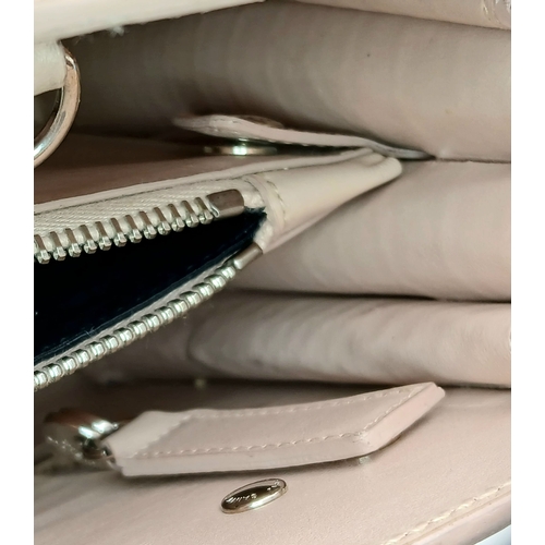 54 - A Baby Pink Saint Laurent Sac de Jour Handbag. Baby pink crocodile-embossed leather exterior with si... 