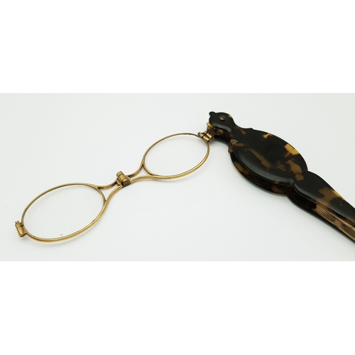 94 - An Antique Pair of Folding Lorgnette Glasses. Spring loaded with a push button-mechanism to flip ope... 