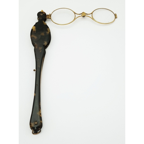 94 - An Antique Pair of Folding Lorgnette Glasses. Spring loaded with a push button-mechanism to flip ope... 