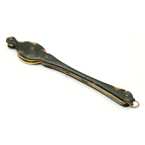 94 - An Antique Pair of Folding Lorgnette Glasses. Spring loaded with a push button-mechanism to flip ope... 