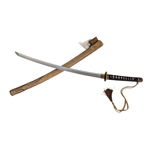 99 - WW2 Japanese Officers Katana Sword. Complete with knot and leather scabbard cover. A bring back from... 