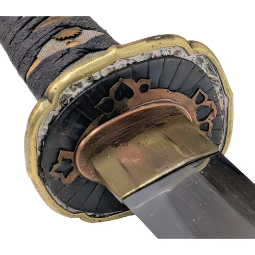 99 - WW2 Japanese Officers Katana Sword. Complete with knot and leather scabbard cover. A bring back from... 