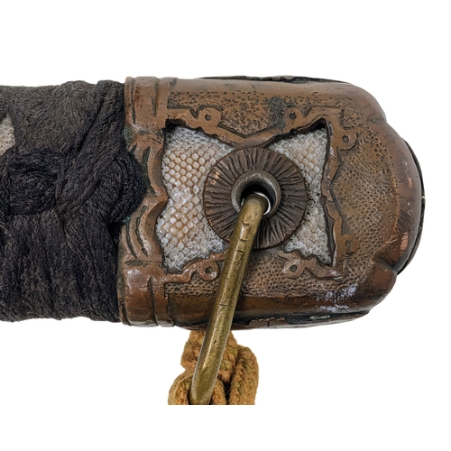 99 - WW2 Japanese Officers Katana Sword. Complete with knot and leather scabbard cover. A bring back from... 