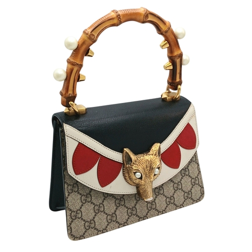 40 - A Gucci GG Supreme Fox Head Bamboo Handle Handbag. Beige GG Supreme canvas exterior with black, whit... 