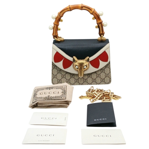 40 - A Gucci GG Supreme Fox Head Bamboo Handle Handbag. Beige GG Supreme canvas exterior with black, whit... 