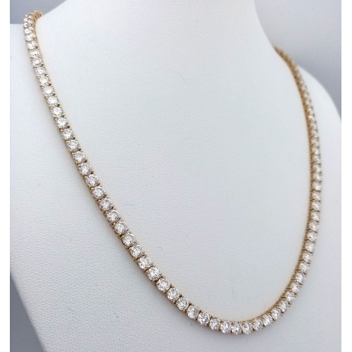 51 - A W.G.I Certified 10K Yellow Gold and Lab Diamond Tennis Necklace. 114 round brilliant cut diamonds ... 