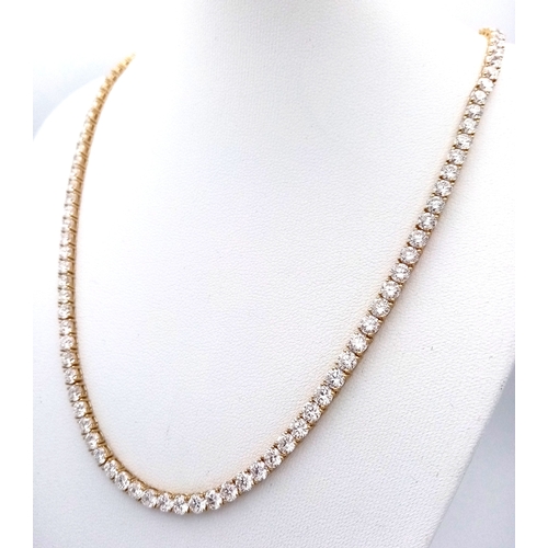 51 - A W.G.I Certified 10K Yellow Gold and Lab Diamond Tennis Necklace. 114 round brilliant cut diamonds ... 