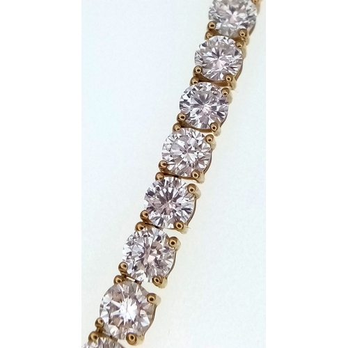 51 - A W.G.I Certified 10K Yellow Gold and Lab Diamond Tennis Necklace. 114 round brilliant cut diamonds ... 