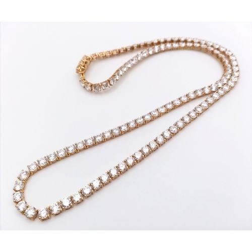 51 - A W.G.I Certified 10K Yellow Gold and Lab Diamond Tennis Necklace. 114 round brilliant cut diamonds ... 