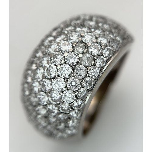 An 18K White Gold and Diamond Cluster Dress Ring. 3.3ctw of pave-set round brilliant cut diamonds over seven levels. G-H colour with VS2-SI1 clarity. 12mm widest point. Size K. 10g total weight. Ref: 4/98006.