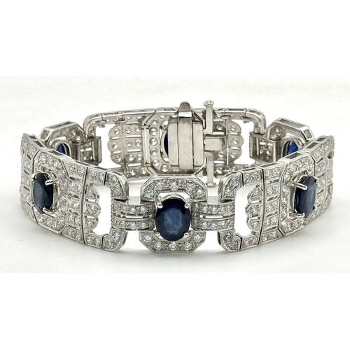 A W.G.I Certified, Fabulous Art Deco-Style 18K White Gold, Sapphire and Diamond Link Bracelet. Articulated panels set with six oval sapphires of 20ctw. 264 round brilliant cut diamonds of 10.50ctw having F-G colour with VS2-SI1 clarity surround and compliment these magnificent stones. 18cm length. 40.44g total weight. Ref: NL17.