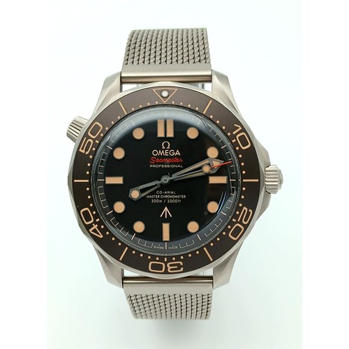 An Unworn Omega Seamaster Diver 300M James Bond 007 &lsquo;No Time to Die&rsquo; Titanium Watch. This is the same model timepiece featured in the Bond Film, with the addition of this having the more expensive Milanese Titanium strap (&pound;1100 extra when added to the watch base value). This is a military grade divers watch resistant to 300m. 42mm case. Co-Axial Master Chronometer 8806 Automatic Movement. &lsquo;Tropical Brown&rsquo; Aluminium Dial and Bezel. Special Edition Watch celebrating 30 years of association with the Bond Franchise. Complete with box, travel case as issued with the watch, manual etc