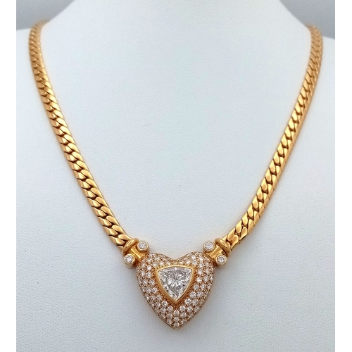 A W.G.I Certified, Stunning, Majestic, 18K Yellow Gold and Diamond Lavaliere Necklace. A Heart-shaped pendant with a centre 2.05ct trilliant cut diamond having G colour and SI1 clarity - Surrounded by Seventy-Four round brilliant cut diamonds of 2ctw having G-H colour and VS1-2 clarity. 4.05ctw diamonds. Makers mark of by P.J. Watson. Pendant 28 x 20mm. Necklace - 42cm. 40.91g total weight.