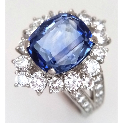 A Breath-Taking, GIA Certified, 950 Platinum, Natural Sapphire and Diamond Dress Ring. Set with a 4.47ct cushion cut natural blue sapphire of Sri Lankan origin, surrounded by diamond accents to the shoulders and mount. Sapphire measures 9.72mm x 8.40mm x 5.32mm. 9.87g total weight. Size M 1/2. Ref: CDB-01
