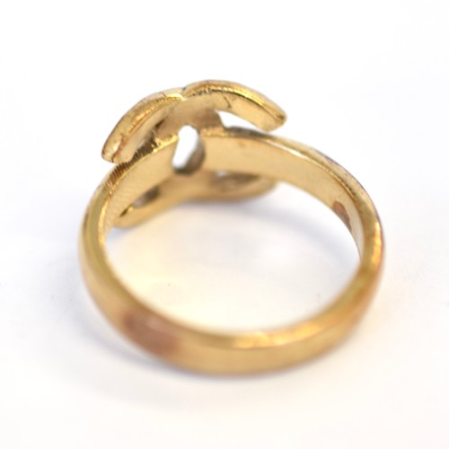 134 - 9ct CC diamond ring. Ring size M. Weighing 3.90g. Head measures 10.20mm. Good condition - tarnish to... 