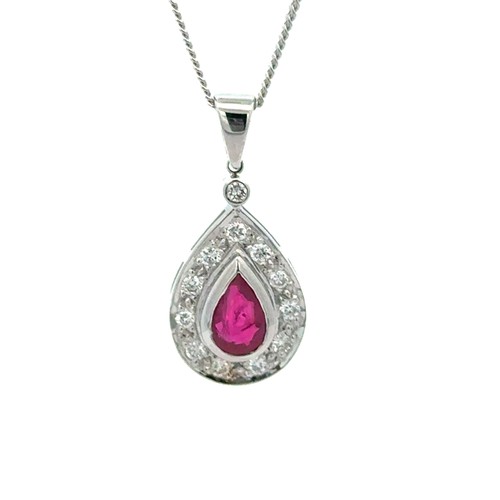 Ruby & Diamond Pendant & Chain. 18ct white gold ruby and diamond pendant and chain. Set with approximately .60ct diamonds. Pendant measures 23.50 x 11.20mm. 18" long chain. Weighing 5.50g.