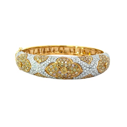 13 - Natural Yellow & White Diamond Bangle Set in 18ct yellow gold, set with 2.82ct colourless diamon... 