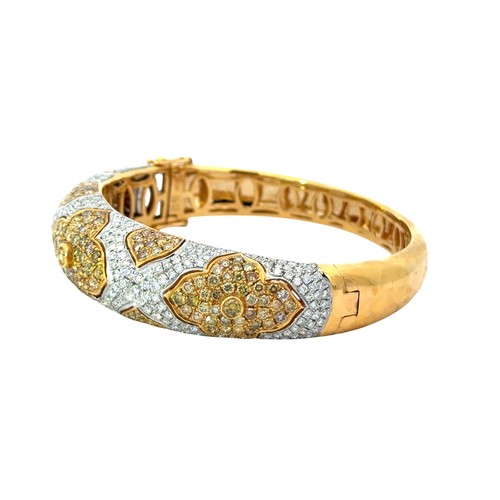 13 - Natural Yellow & White Diamond Bangle Set in 18ct yellow gold, set with 2.82ct colourless diamon... 