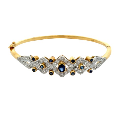 127 - 18ct Sapphire & Diamond Bangle  Set with .90ct of natural blue sapphires, and .87ct of natural d... 