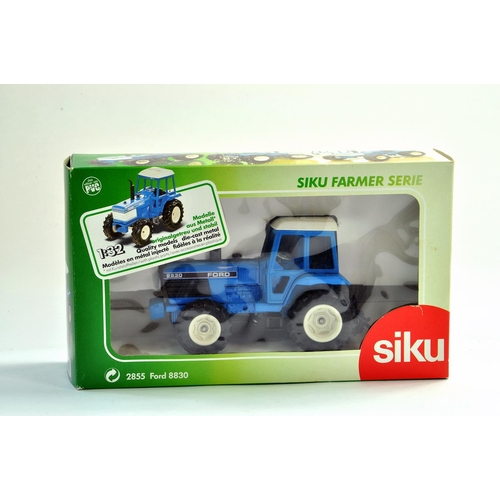 176 - Siku Farm issue comprising 1/32 Ford 8830 Tractor. Appears excellent with box. Condition Reports: Pl... 