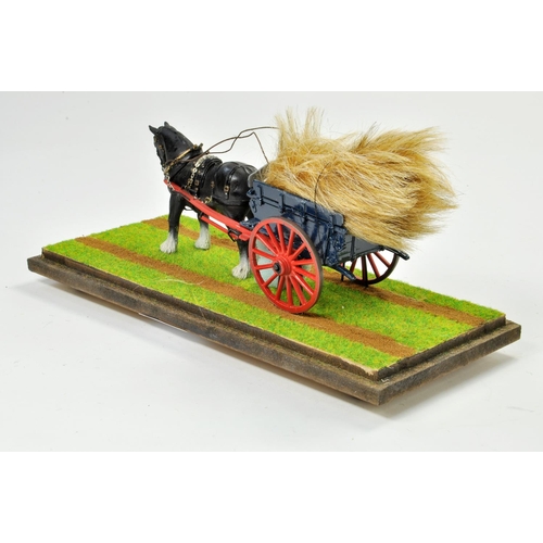 189 - 1/32 Model Farm Issue comprising horse and tumbrel cart combination with hay load. Well presented mo... 