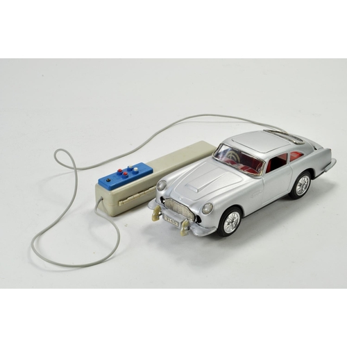 1185 - Bandai / GAMA large scale tinplate battery operated issue comprising James Bond 007 Aston Martin. Wo... 