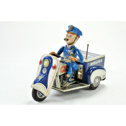 1188 - TN Nomura battery operated tinplate Police Tricycle with Rider. Working example is bright and genera... 