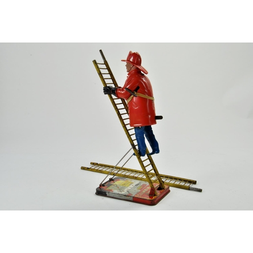 1209 - Marx Mechanical Smokey Joe Climbing Fireman with extendable ladder. Some wear but still functional.