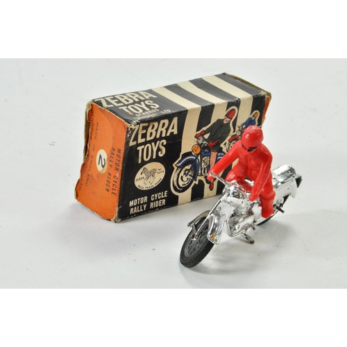 1296 - Benbros Zebra Toys Motorcycle Rally Rider comprising chrome bike and red plastic rider. Some wear he... 