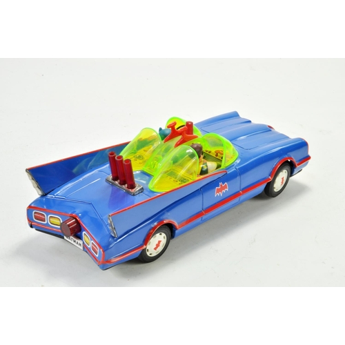 1183 - ASC Japanese large scale tinplate battery operated issue comprising the Batmobile with batman and ro... 