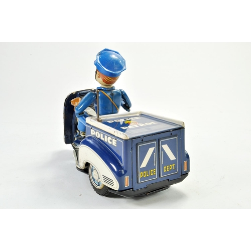 1188 - TN Nomura battery operated tinplate Police Tricycle with Rider. Working example is bright and genera... 