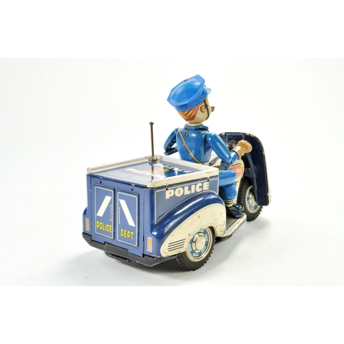 1188 - TN Nomura battery operated tinplate Police Tricycle with Rider. Working example is bright and genera... 